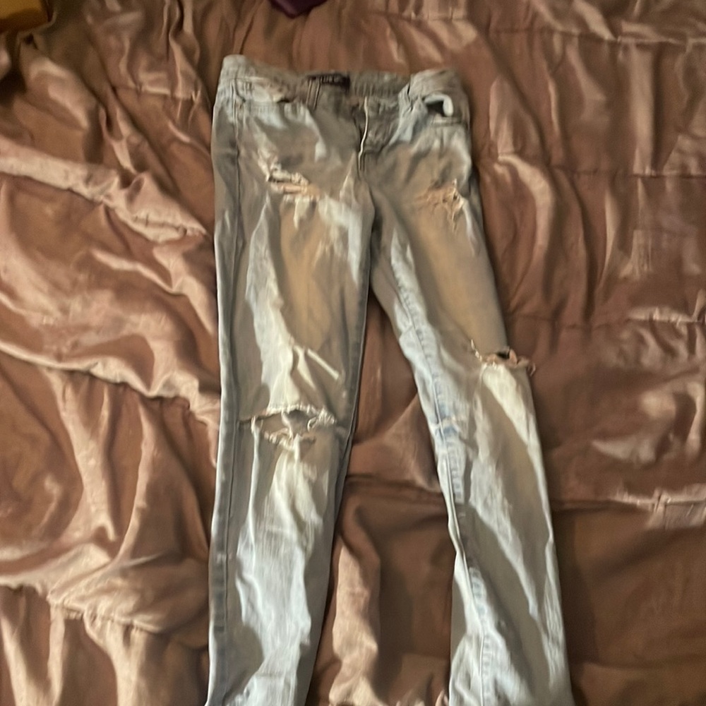 Light wash jeans with rips in it ORIGINALLY from BlueSpice